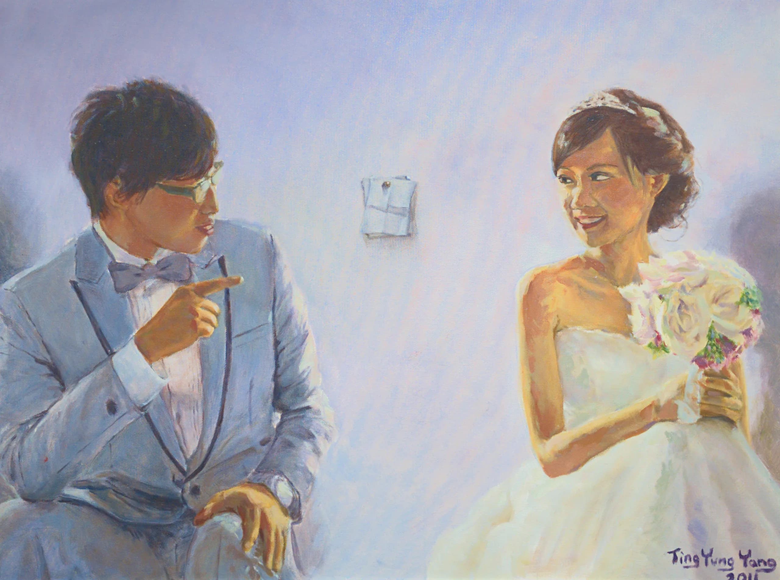 A bride and groom seated, turning toward each other